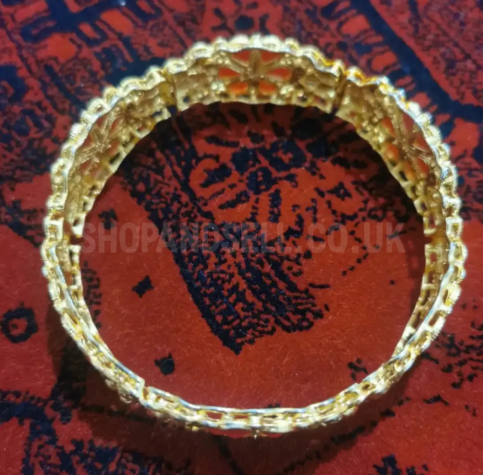 Gold-Tone Ornate Bangle Bracelet with Red Floral Design